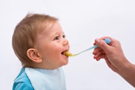 Baby being fed