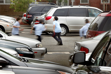 children play in parking lot