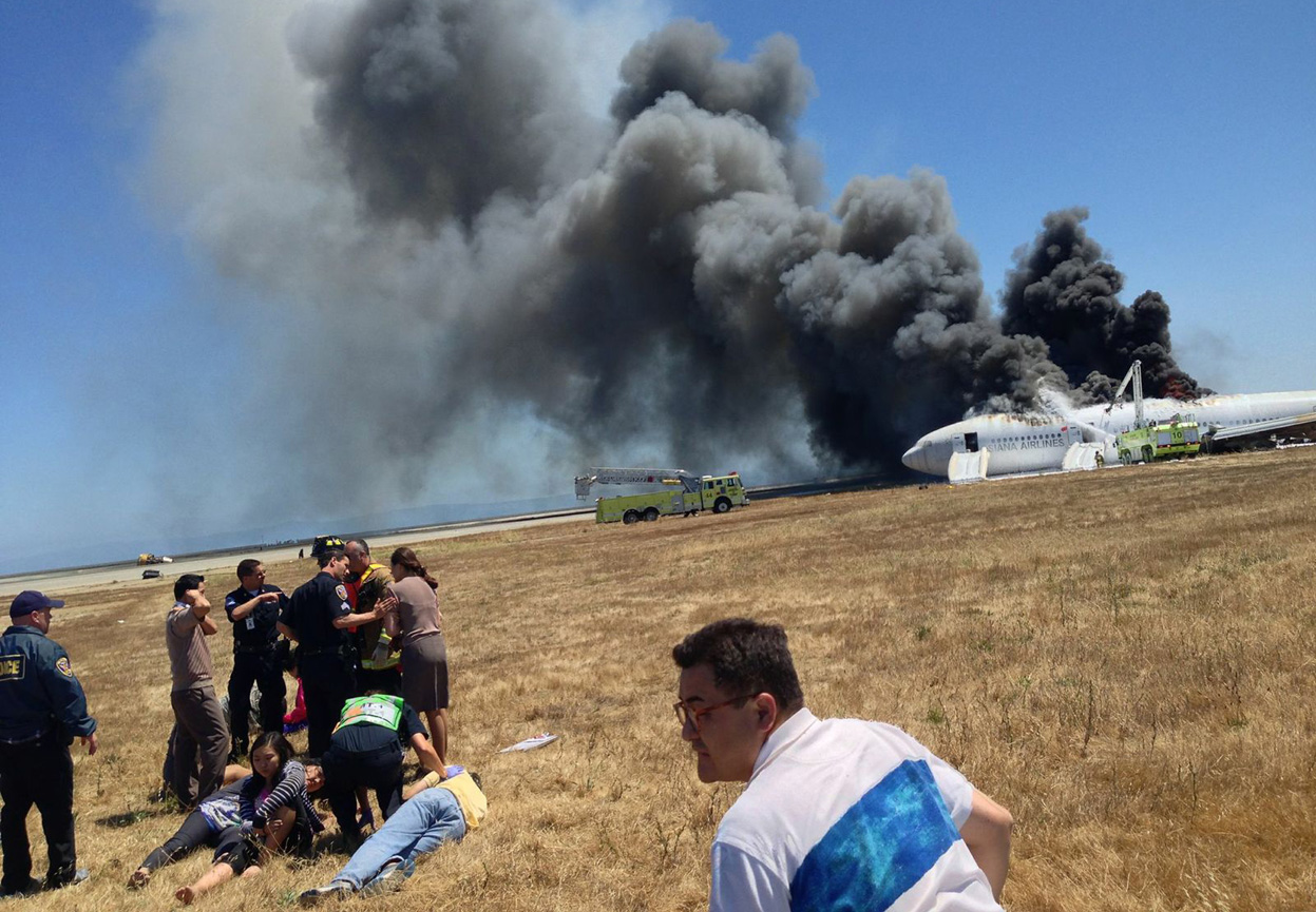 Fire crews rush to put out the flames raging throughout the fuselage in order to stop a potential explosion