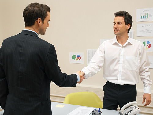 businessman shaking hands with one of his vendors